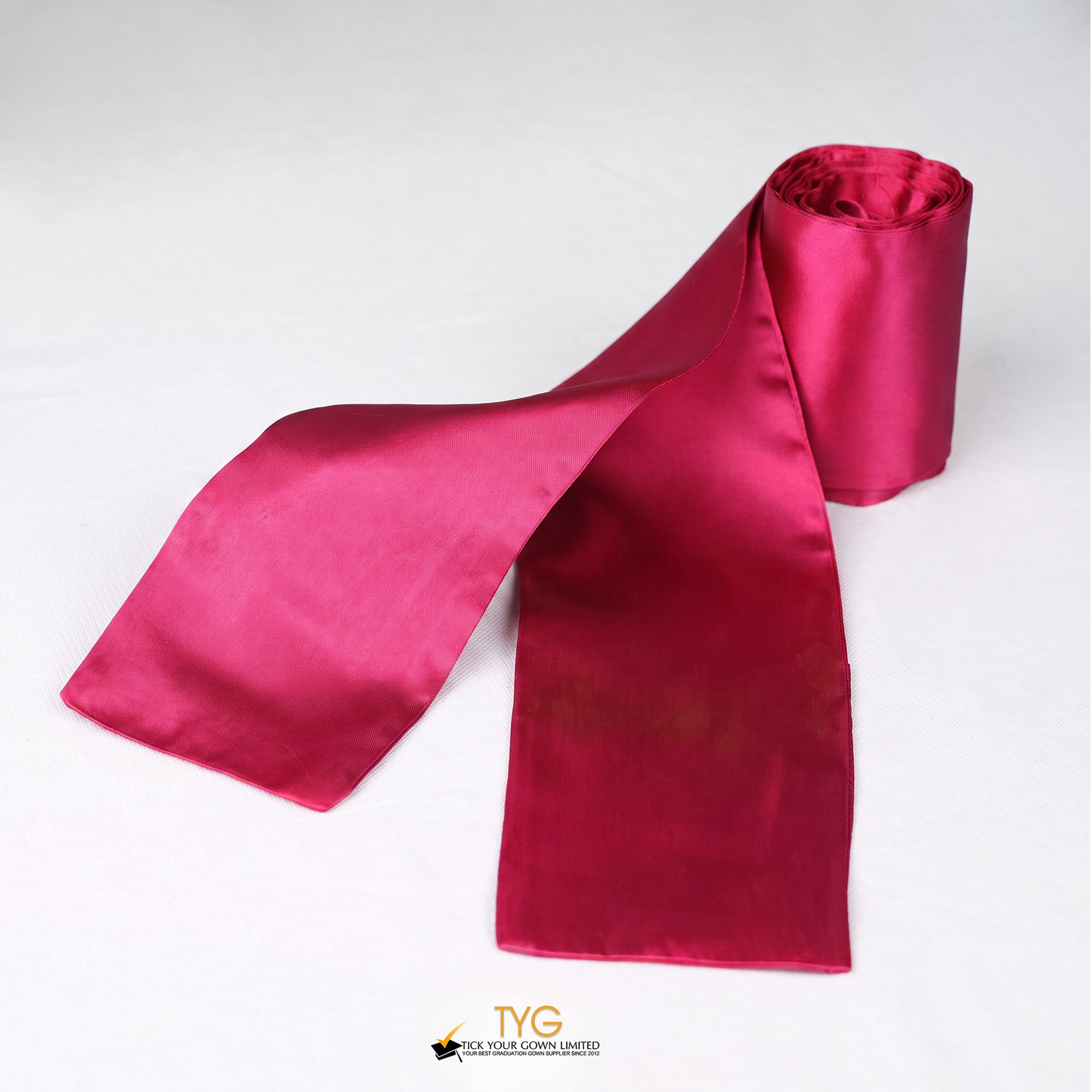 Red satin rolled graduation sash stole on a white background.