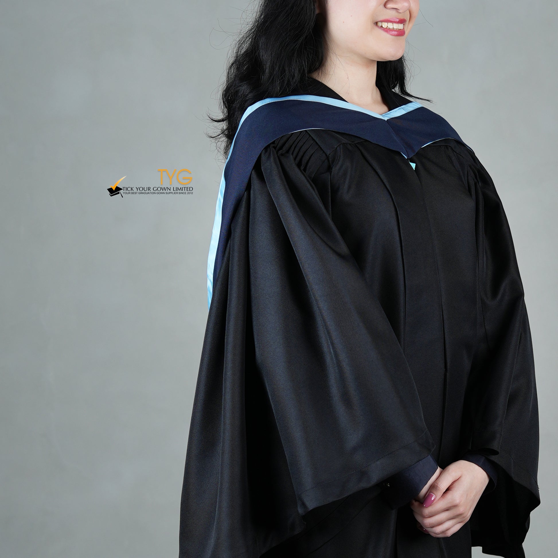 black dress with blue graduation gown graduation
