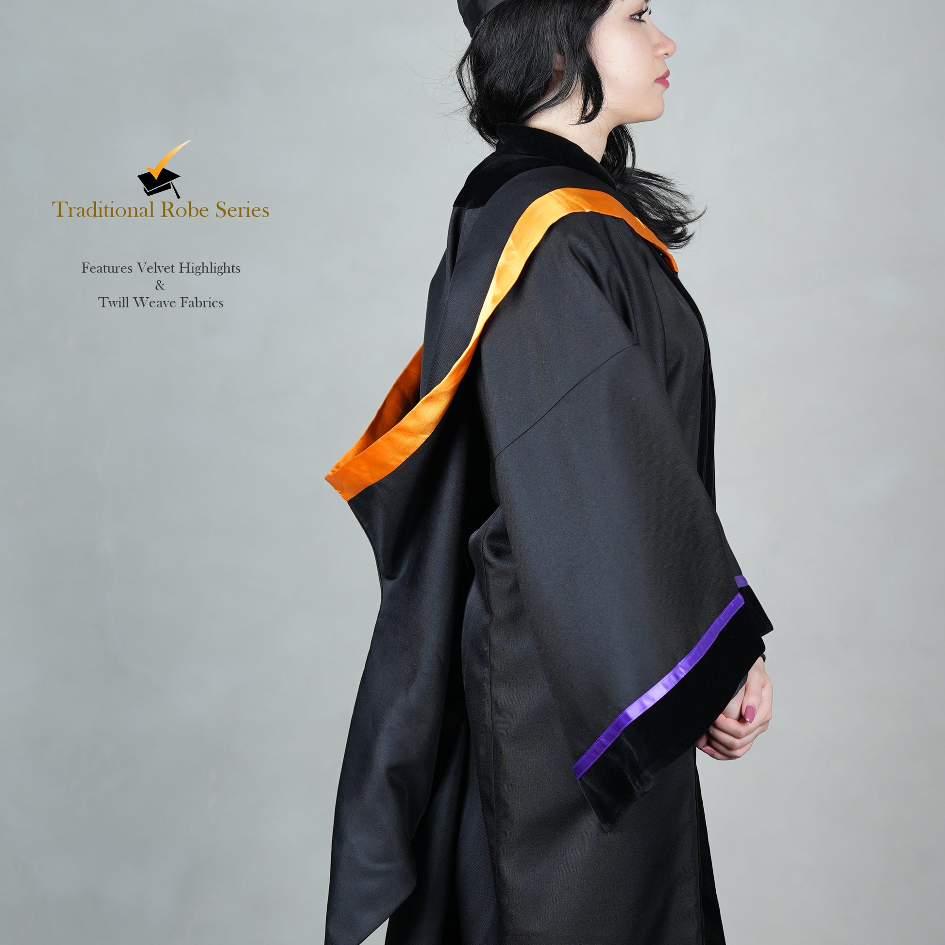 A person wearing a black bachelor graduation gown in side view with velvet highlights, snap-on hood design, and a mortarboard set.