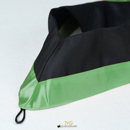 Detailed view of a bachelor’s graduation hood in black with green satin lining.