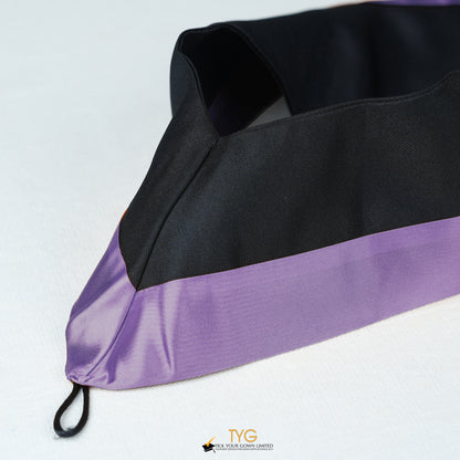 Detailed view of a bachelor’s graduation hood in black with purple satin lining.
