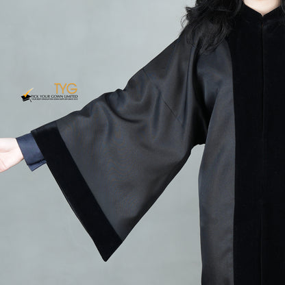 A detailed view of the sleeve of a bachelor black velvet traditional gown
