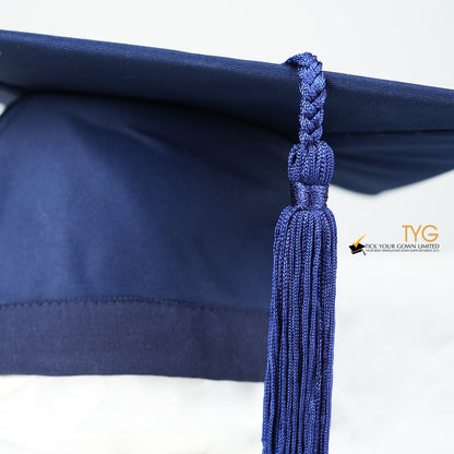 A detailed view of a blue tassel on a white background.