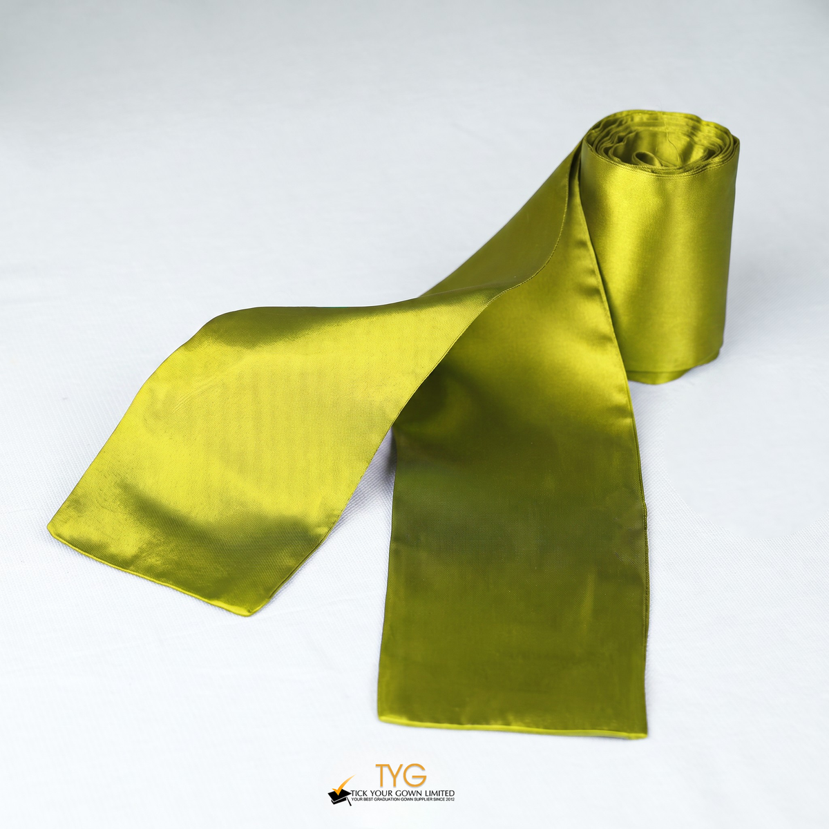 Yellow satin rolled graduation sash on a white background.