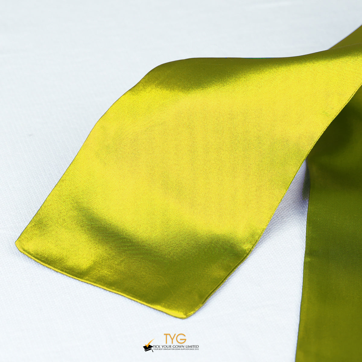 Detailed view of a yellow graduation sash fabric on a white background.