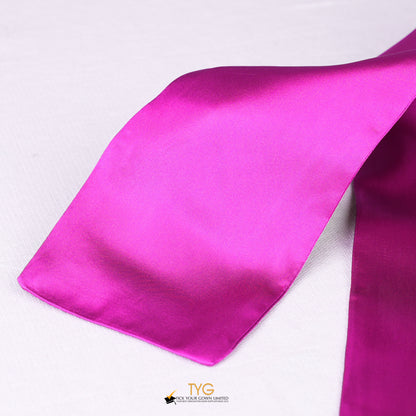 Detailed view of a pink graduation sash fabric on a white background.