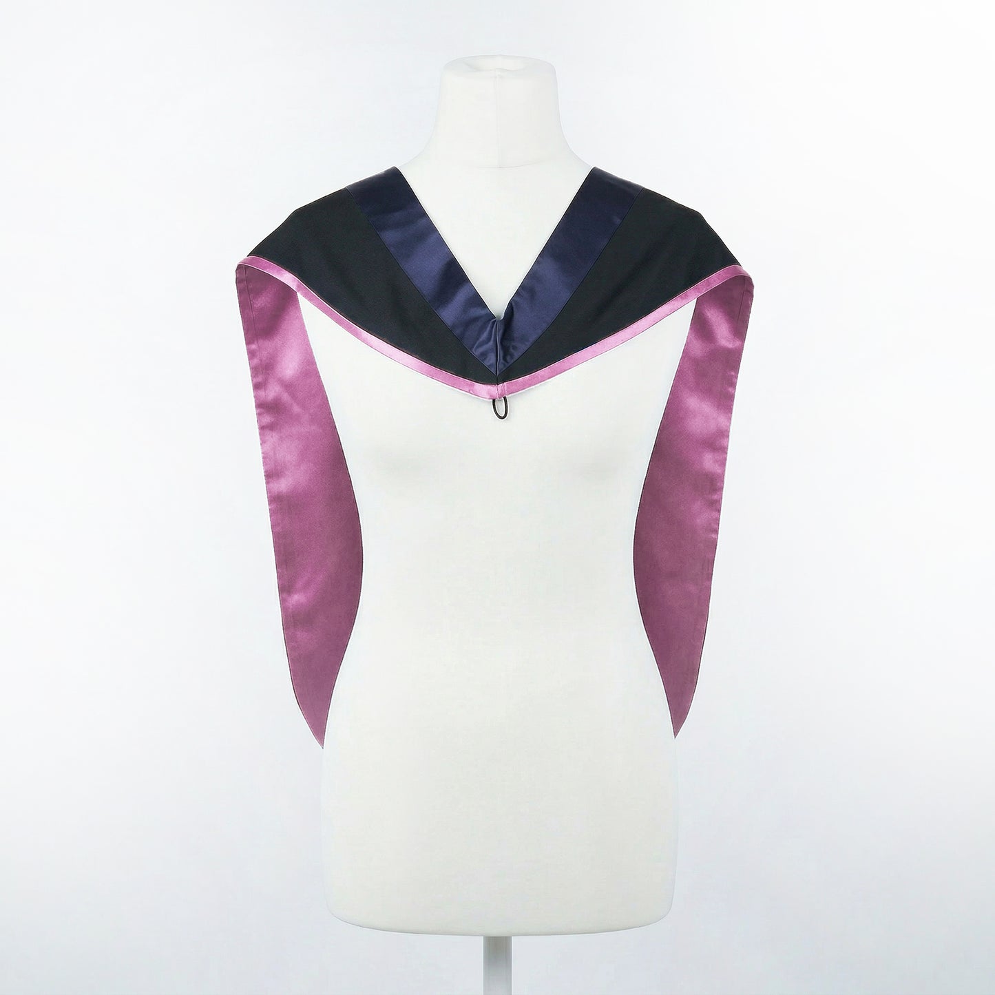 Master's graduation hood displayed on a mannequin showing full shape with black body, dark navy blue hood, and lilac satin lining.