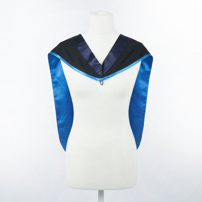 Master's graduation hood displayed on a mannequin showing full shape with black body, dark navy blue hood, and skyblue satin lining.