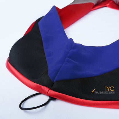 Close-up of a master's graduation hood featuring black fabric with blue velvet hood and red satin lining.