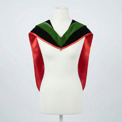 Master's graduation hood displayed on a mannequin showing full shape with black velvet body, forest green velvet hood and red satin lining.