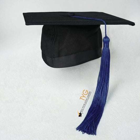Black graduation cap with dark blue tassel on a white background
