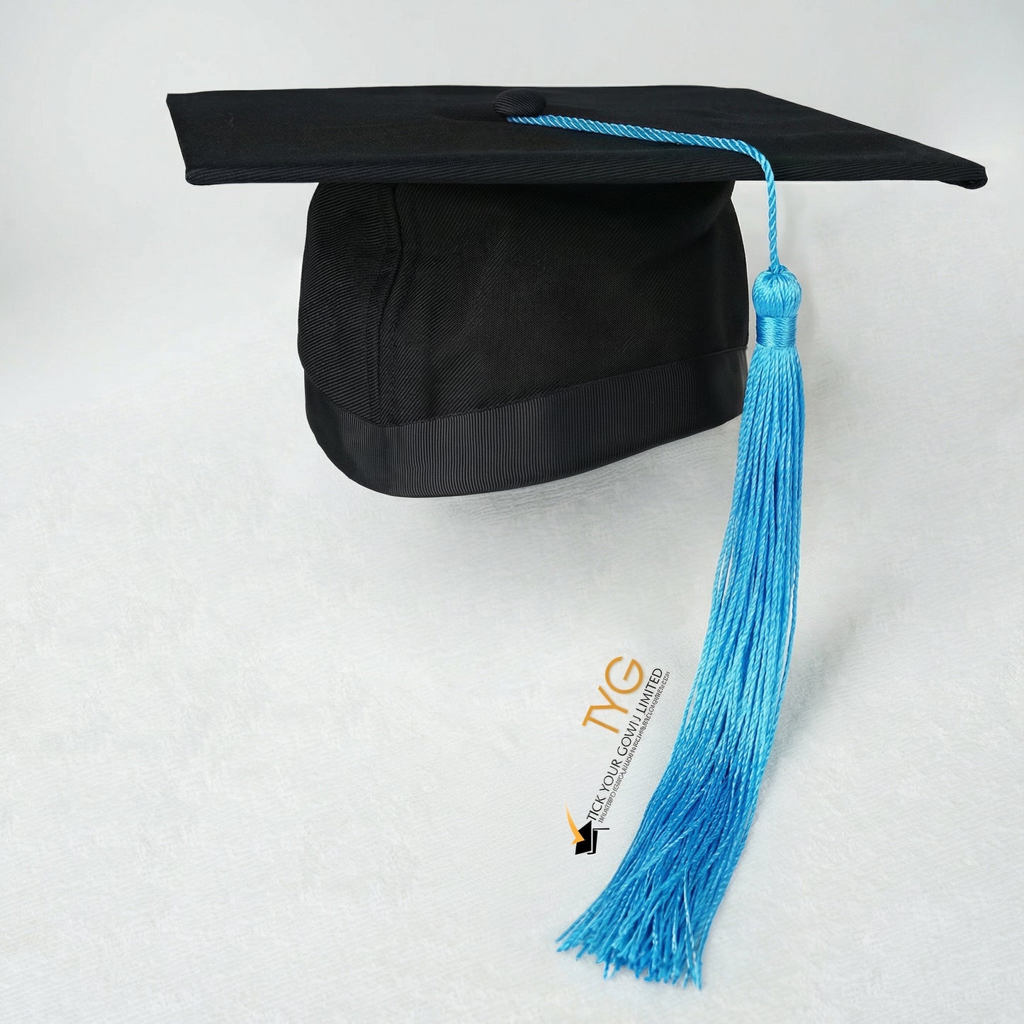 Black graduation cap with blue tassel on a white background