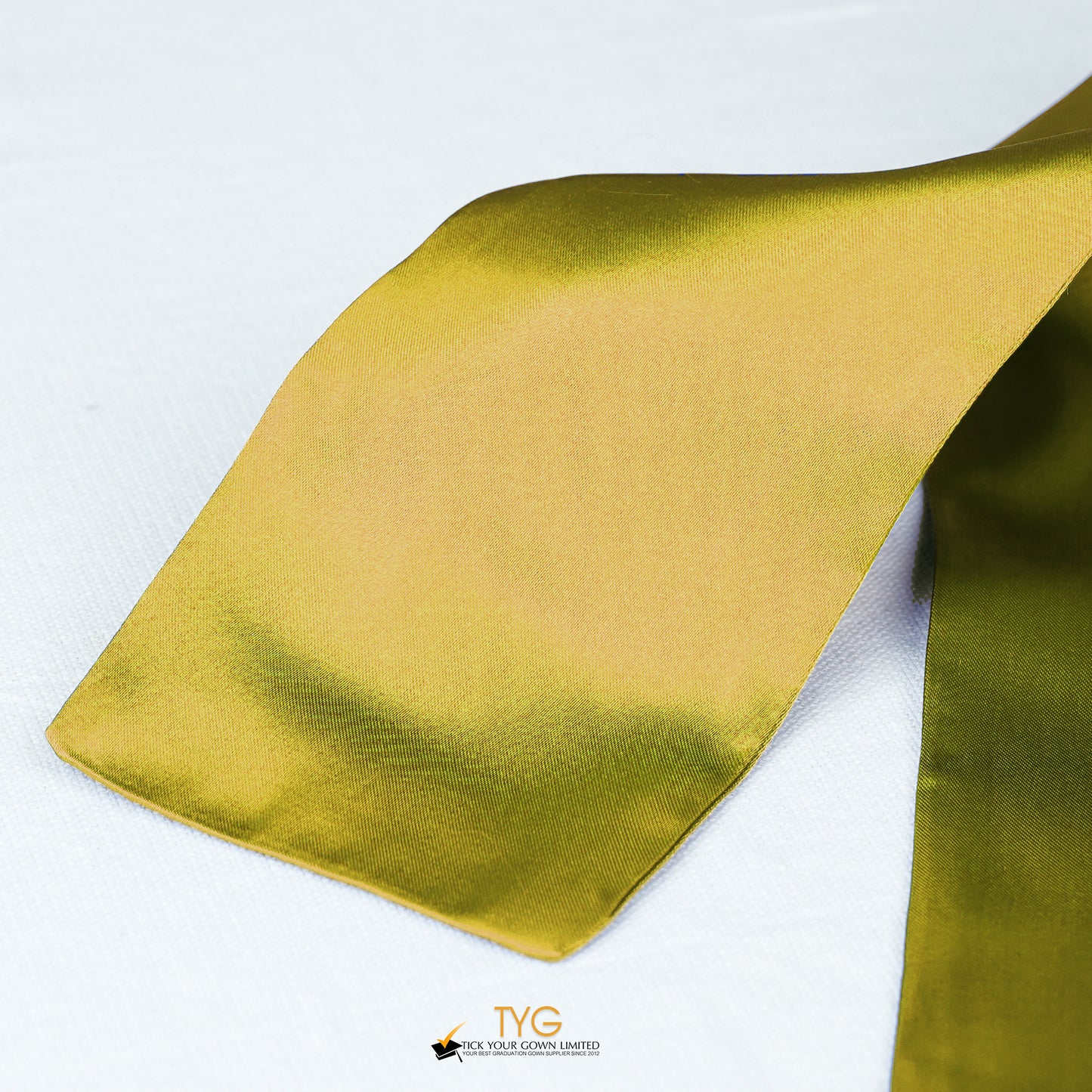 Detailed view of a gold stole fabric on a white background.