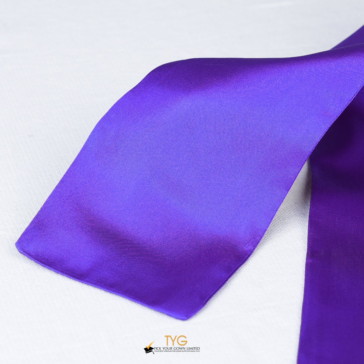 Detailed view of a purple stole fabric on a white background.