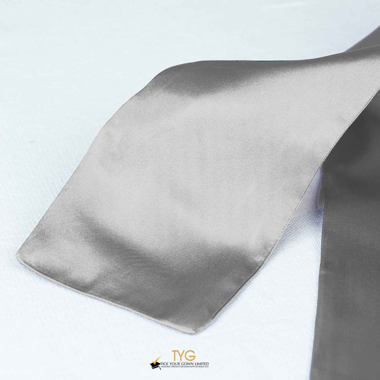 Detailed view of a silver stole fabric on a white background.